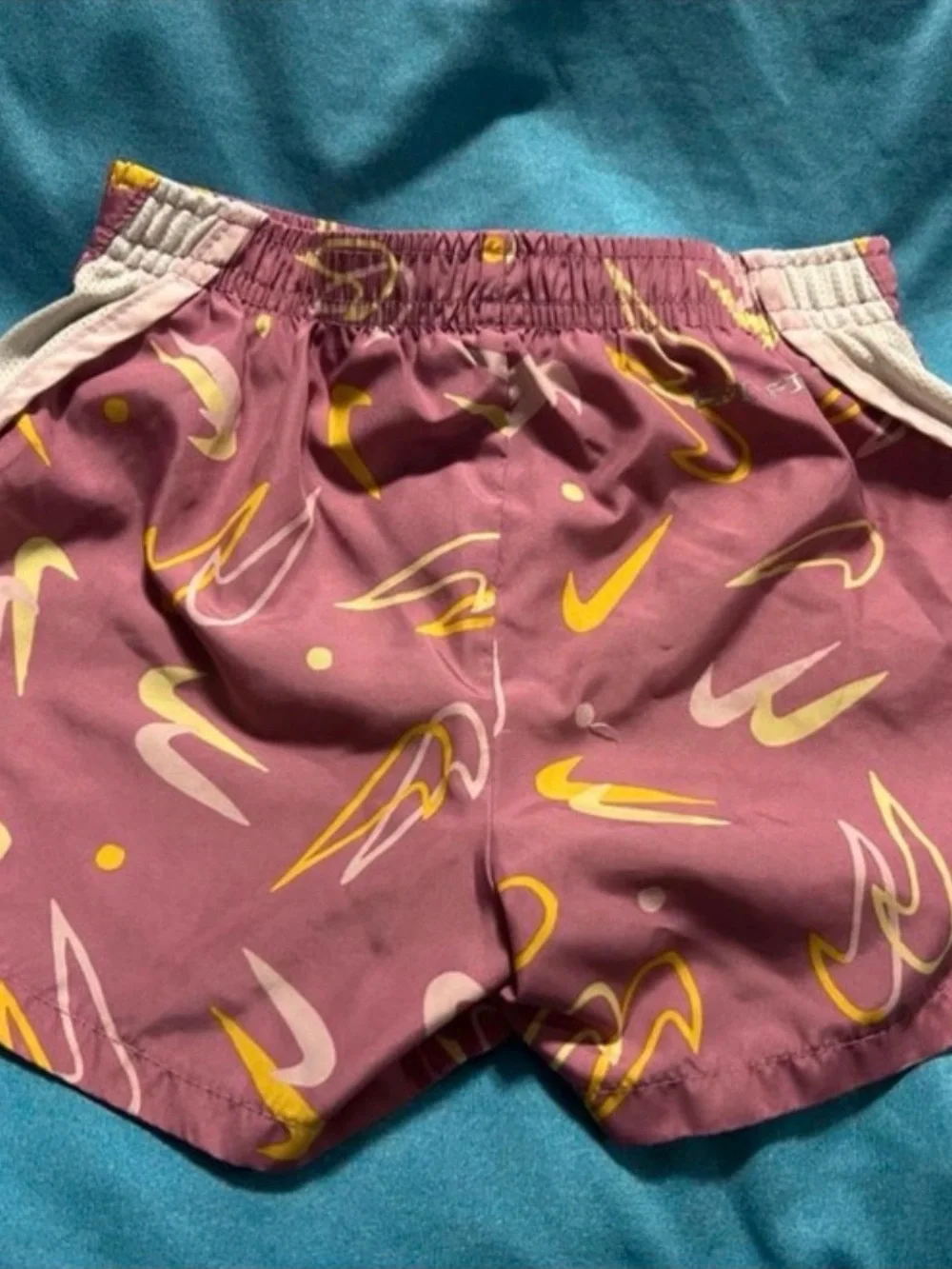 Nike Mauve-Pink Athletic Shorts with Yellow & White Swoosh Print